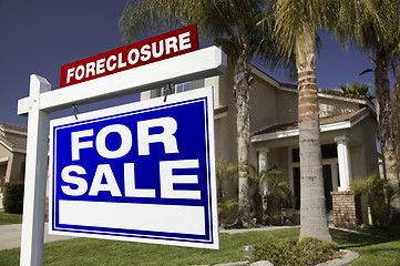 Image showing Foreclosure For Sale Real Estate Sign and House