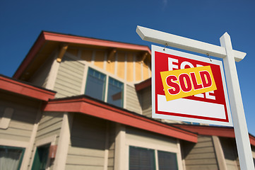 Image showing Sold Home For Sale Sign in Front of New House 