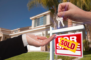 Image showing Handing Over the House Keys in Front of New Home