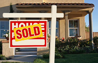 Image showing Sold Home For Sale Sign in Front of New House 