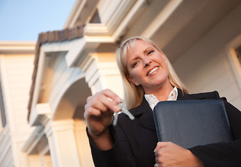 Image showing Real Estate Agent Handing Over Keys to New Home