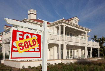 Image showing Sold Home For Sale Sign in Front of New House 