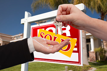 Image showing Agent Handing Over the Key to a New Home