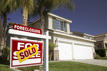 Image showing Red Foreclosure For Sale Real Estate Sign and House