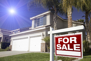 Image showing Red For Sale Real Estate Sign and House