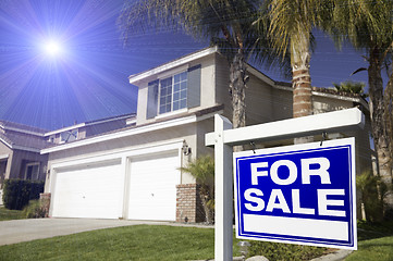 Image showing Blue For Sale Real Estate Sign and House