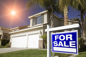 Image showing Red For Sale Real Estate Sign and House