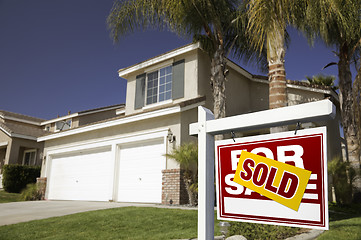 Image showing Red Sold For Sale Real Estate Sign and House