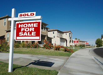 Image showing Sold Home For Sale Sign & New House