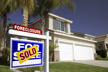 Image showing Blue Foreclosure For Sale Real Estate Sign and House