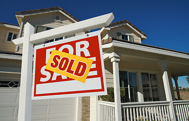 Image showing Sold Home For Sale Sign in Front of New House 