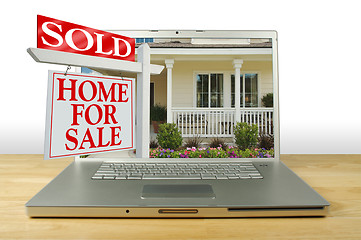 Image showing Sold Home For Sale Sign on Laptop