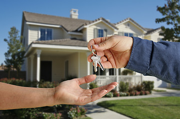 Image showing Handing Over the House Keys in Front of New Home