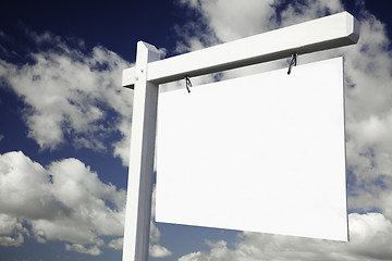 Image showing Blank Real Estate Sign on Cloudy Sky 