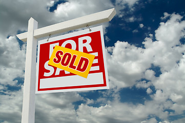 Image showing Sold For Sale Real Estate Sign on Clouds