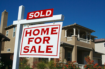 Image showing Sold Home For Sale Sign & New House