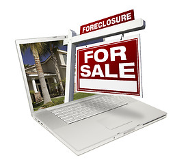 Image showing Foreclosure Home for Sale Real Estate Sign & Laptop