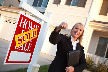 Image showing Female Real Estate Agent Handing Over the House Keys