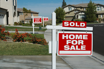 Image showing Sold Home For Sale Sign & New House