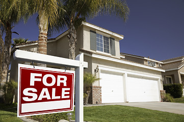 Image showing Red For Sale Real Estate Sign and House