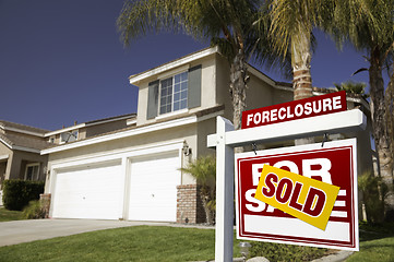 Image showing Red Foreclosure For Sale Real Estate Sign and House