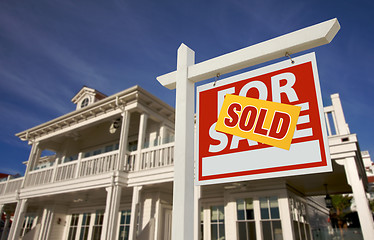 Image showing Sold Home For Sale Sign in Front of New House 