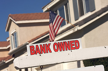 Image showing Bank Owned Real Estate Sign and House with American Flag