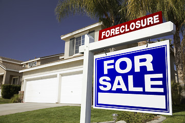 Image showing Foreclosure For Sale Real Estate Sign and House