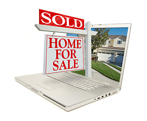 Image showing Sold Home for Sale Sign & New Home on Laptop