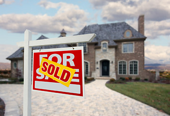 Image showing Sold Home For Sale Sign in Front of New House 