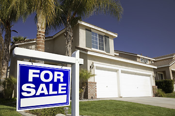 Image showing Blue For Sale Real Estate Sign and House