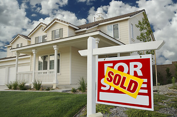 Image showing Sold Home For Sale Sign and House