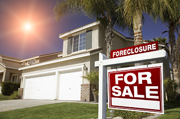 Image showing Red Foreclosure For Sale Real Estate Sign and House