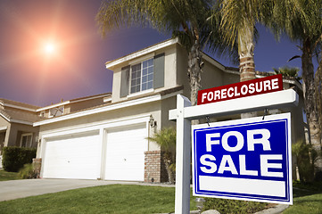 Image showing Red Foreclosure For Sale Real Estate Sign and House