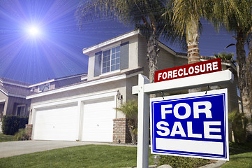 Image showing Red Foreclosure For Sale Real Estate Sign and House