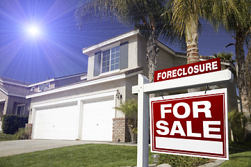 Image showing Red Foreclosure For Sale Real Estate Sign and House