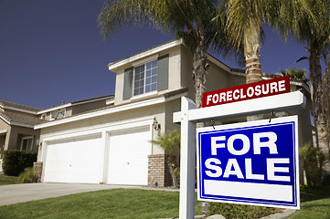 Image showing Blue Foreclosure For Sale Real Estate Sign and House