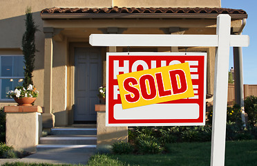 Image showing Sold Home For Sale Sign and House