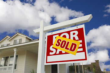 Image showing Sold Home For Sale Sign in Front of New House 