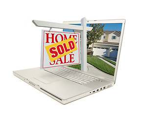Image showing Sold Home for Sale Sign & New House on Laptop