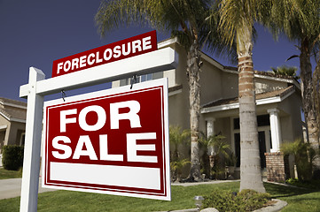 Image showing Foreclosure For Sale Real Estate Sign and House