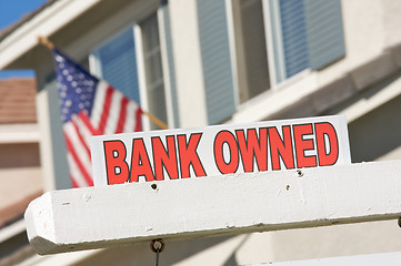 Image showing Bank Owned Real Estate Sign and House with American Flag