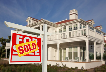 Image showing Sold Home For Sale Sign in Front of New House 