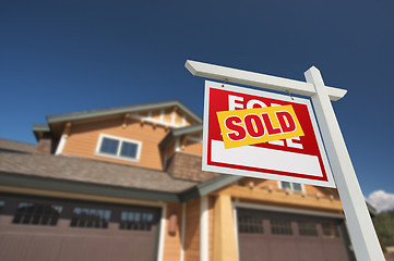 Image showing Sold Home For Sale Sign in Front of New House 