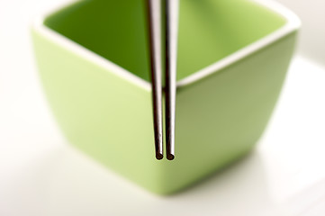 Image showing Chopsticks & Green Bowl