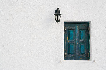 Image showing Abstract close-up of Santorini home wall, window and lamp.