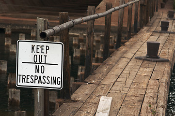 Image showing Sign and Abandoned Dock