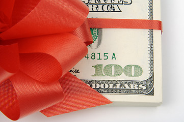 Image showing One Hundred Dollar Bills Wrapped in Red Ribbon.