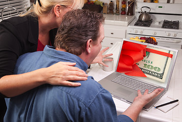 Image showing Couple In Kitchen Using Laptop - Money