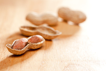 Image showing Peanuts on Wood Background